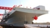In this photo released by Xinhua News Agency, China's first Type 076 new-generation amphibious assault ship, the Sichuan, is seen in Shanghai, Dec 27, 2024. (Li Yun/Xinhua via AP)