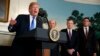 President Donald Trump speaks before signing a presidential memorandum on the imposition of tariffs and investment restrictions on China, in the Diplomatic Reception Room of the White House, March 22, 2018, in Washington. From left are Trump, Secretary of Commerce Wilbur Ross, U.S. Trade Representative Robert Lighthizer and White House homeland security adviser Tom Bossert.