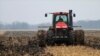 FILE - A farmer cultivates his field near Farmingdale, Ill., Dec. 4, 2009.