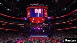 U.S President Donald Trump is shown on a screen on the Inauguration Day of his second presidential term, inside Capital One Arena in Washington on Jan. 20, 2025.