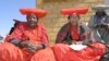 Herero women attend a gathering in Okokarara, Namibia, Aug. 14, 2004 where Germany's Development Aid Minister, Heidemarie Wieczorek-Zeul, unseen, offered Germany's first apology for a colonial-era crackdown that killed 65,000 ethnic Hereros between 1904 and 1908. 