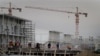 FILE - Workers are seen at an area under construction at the U.S. embassy in Kabul, Afghanistan, April 4, 2012.