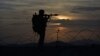FILE - A Pakistani border security guard stands alert at Pakistan-Afghanistan border post at Chaman, May 5, 2017. The U.S. had recently decided to withhold $50 million in military aid to Pakistan for failing to do enough against the Haqqani network.