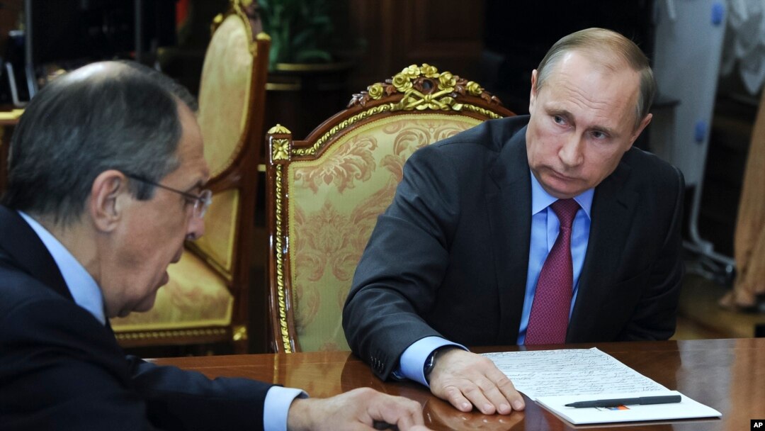 FILE - Russian President Vladimir Putin, right, listens to Russian Foreign Minister Sergey Lavrov during their meeting in the Kremlin in Moscow, Russia, March 14, 2016. 
