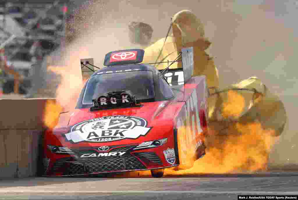 NHRA car driver Alexis DeJoria suffers an engine fire after winning her first matchup during the Fall Nationals at Texas Motorplex in Ennis, Texas, Oct. 18, 2020. DeJoria was uninjured in the fiery incident.