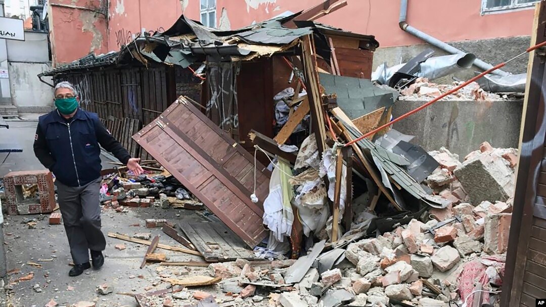 A man inspects the damage caused by an earthquake in Zagreb, Croatia, March 22, 2020. A strong earthquake shook Croatia and its capital, causing widespread damage and panic. 