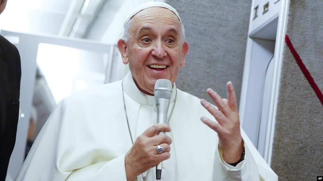 Pope Francis talks to journalists during a press conference en route to Italy from the United States, Sept. 28, 2015. 