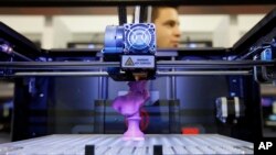 FILE - A 3D desktop printer is on display at the International Consumer Electronics Show in Las Vegas, Nevada.