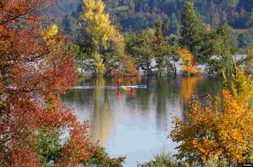 People paddle on Planinsko polje in Planina, Slovenia.