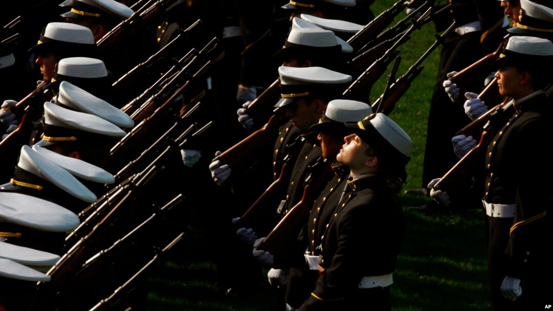 A midshipman lifts her face to the sun at the end of a formal dress parade by the Brigade of Midshipmen at the U.S. Naval Academy in Annapolis, Md. on Wednesday, April 7, 2010. (AP Photo/Jacquelyn Martin)