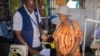 Adelle Mubalama, right, a tailor with a shop at Kenya's Kakuma refugee camp, was able to launch a business when she got a loan from Inkomoko. The organization helps small business entrepreneurs. (Photo courtesy of Inkomoko)