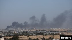 Smoke rises during an Israeli ground operation in Khan Younis