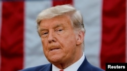 FILE PHOTO: Trump hit with criminal charges in New York, a first for a US ex-president