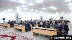 FILE - Libyan Parliament meet to discuss appointment of a new prime minister and formation of a new government, in Tobruk, Libya, Feb. 10, 2022.