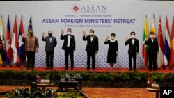 oreign ministers of the Association of Southeast Asian Nations (ASEAN) pose for a photo during a photo session in Phnom Penh, Cambodia.