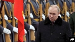 Russian President Vladimir Putin attends a wreath-laying ceremony at the Tomb of the Unknown Soldier. (Alexei Nikolsky, Kremlin Pool Photo via AP)