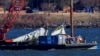 Vađenje delova oluipine aviona Amerikan erlajnsa iz reke Potomak, 4. februar 2025. (REUTERS/Eduardo Munoz)