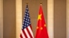 FILE — Undated photo of flags of the U.S. and China. An international military forum in China next week is expected to provide an opportunity for military-to-military contact between the U.S. and China.