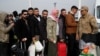 Syrian migrants wait to cross into Syria after Syrian rebels ousted President Bashar al-Assad, at Cilvegozu border gate in Hatay province, Turkey, Dec. 11, 2024.
