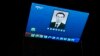 A large screen broadcasts an obituary of the former Chinese premier Li Keqiang outside a mall in Beijing on Oct. 27, 2023.
