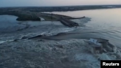 Breached dam in Ukraine's south unleashes floodwaters