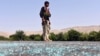FILE - An Afghan soldier keeps watch during clashes with Islamic State (IS) militants in Kot district of Nangarhar province, Afghanistan, June 26, 2016. 