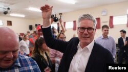 英國工黨領袖施紀賢出席競選活動。(路透社照片)