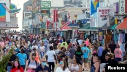Visitors crowd the boardwalk on Memorial Day weekend in Ocean City, Maryland, U.S., May 23, 2020. 
