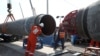 FILE PHOTO: FILE PHOTO: Workers are seen at the construction site of the Nord Stream 2 gas pipeline, near the town of Kingisepp, Leningrad region, Russia, June 5, 2019. REUTERS/Anton Vaganov/File Photo/File Photo