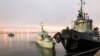 UKRAINE - Three ships of the Naval Forces of Ukraine artillery boats "Nikopol", "Berdyansk" and raid tug "Yani Kapu" (from left to right), towed to the city port, on November 26, 2018.
