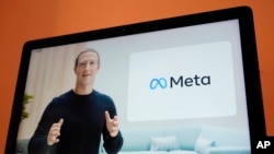 FILE — Mark Zuckerberg, is seen on a device in Sausalito, Calif., Oct. 28, 2021. The CEO of Facebook and Instagram's parent company, Meta, was named, with Meta, as a defendant in lawsuit alleging Facebook and Instagram fail to protect underage users from exposure to predators.