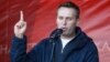 FILE - Russian lawyer and blogger Alexei Navalny attends a rally in Moscow, Oct. 22, 2011.