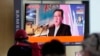 FILE - People watch a TV screen showing an image of North Korean leader Kim Jong Un during a news program at the Seoul Railway Station in Seoul, South Korea, Oct. 12, 2021. 