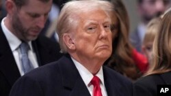 President Donald Trump attends the national prayer service at the Washington National Cathedral, Jan. 21, 2025, in Washington. 