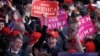 Supporters cheer as they wait for President-elect Donald Trump to give his acceptance speech during his election night rally, Nov. 9, 2016, in New York. 