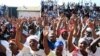 FILE: MDC supporters at a rally in Bulawayo … Human rights monitors warned of an upsurge in political violence in Zimbabwe ahead of a proposed election in 2011.