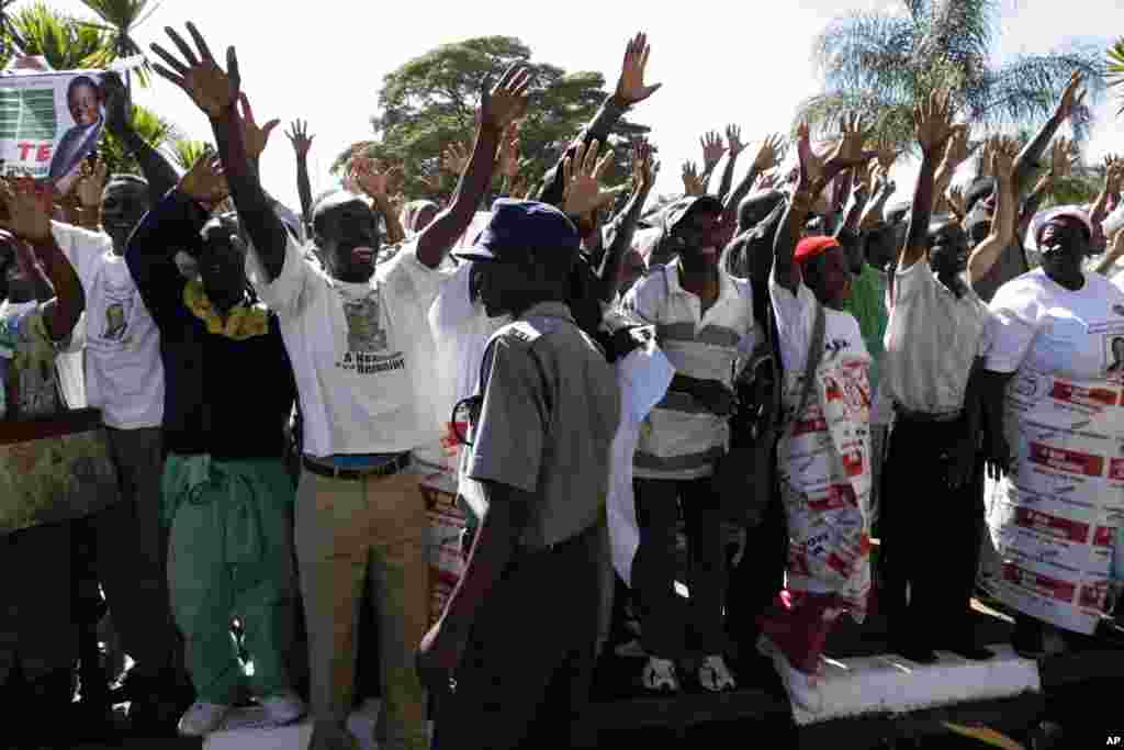 Supporters of Zimbabwe's main opposition leader, Morgan Tsvangirai sing and dance at the signing of the power sharing deal ceremony in Harare, Monday, Sept, 15, 2008.