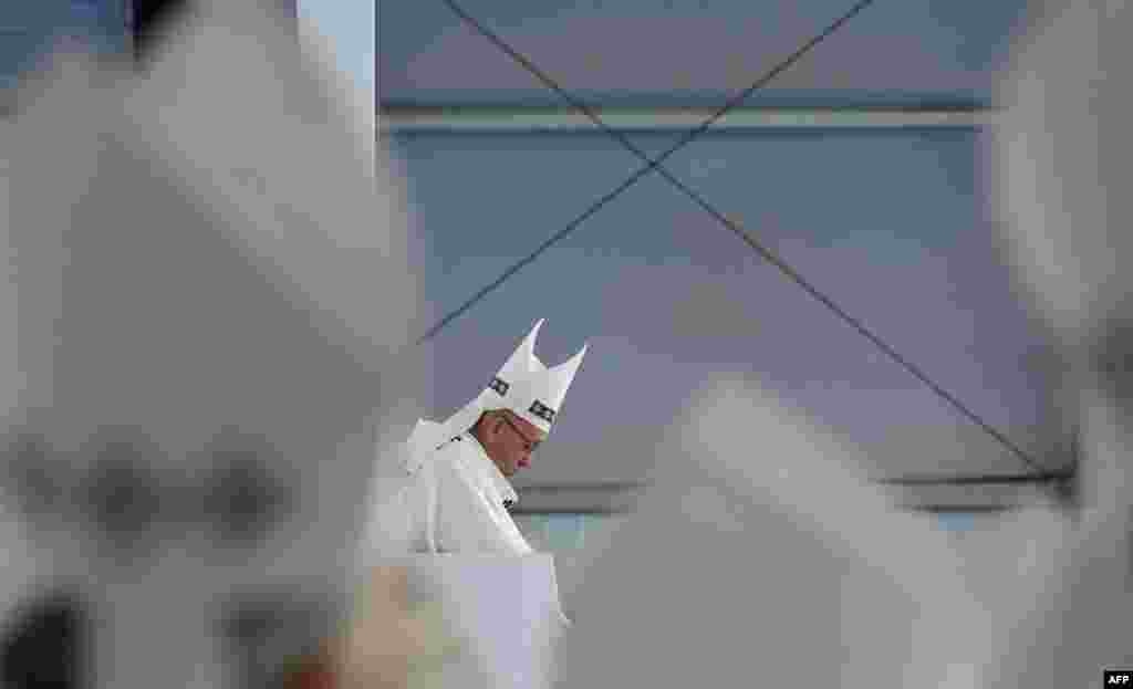 Pope Francis prepares to give an open air mass at the Simon Bolivar Park in Bogota, Colombia. Francis urged Colombians to avoid seeking "vengeance" for the suffering of their country's half-century civil conflict as they work towards a lasting peace.