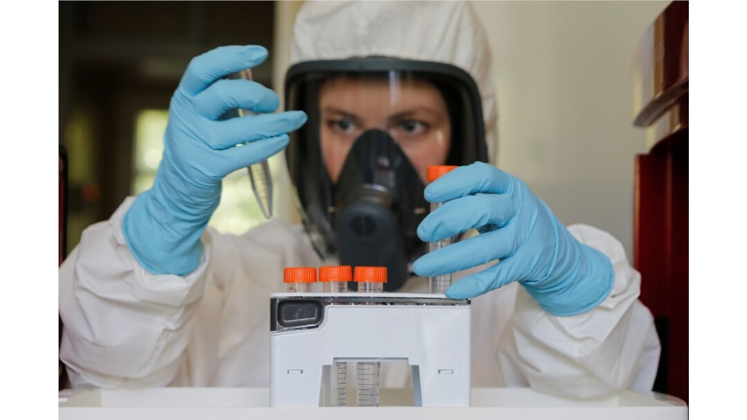 A scientist works inside a laboratory of the Gamaleya Research Institute of Epidemiology and Microbiology during the testing of a coronavirus vaccine, in Moscow, Russia, Aug. 6, 2020. (Russian Direct Investment Fund / Handout via Reuters)