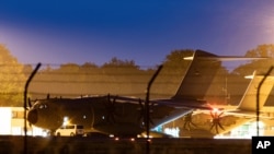 A military transport aircraft, an Airbus A400 M of the German Air Force, stands at the Wunstorf, Germany, air base in Lower Saxony before taking off for Mali, June 25, 2021.