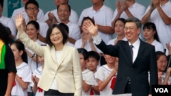 Taiwan's President Tsai Ing-wen, left, and Vice President Chen Chien-jen wave during their inauguration ceremonies in Taipei, Taiwan, Friday, May 20, 2016.