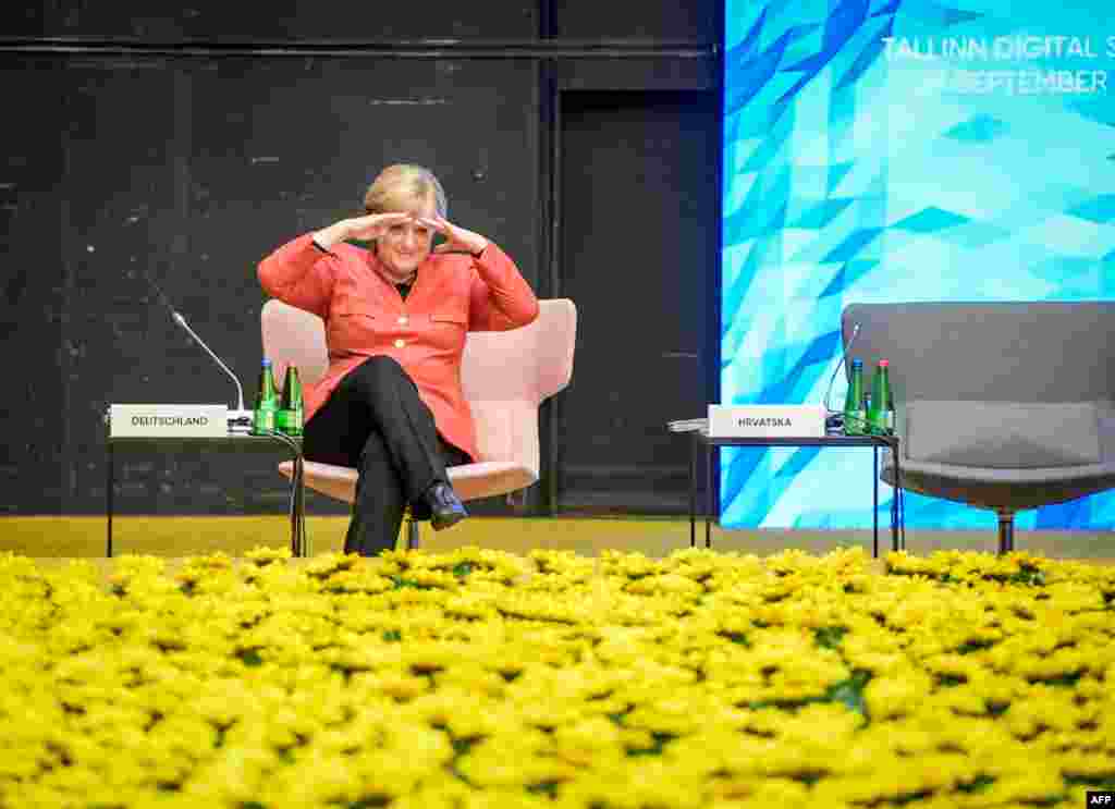 German Chancellor Angela Merkel gestures prior to the 'Tour de table' of the Tallinn Digital Summit during a European Union summit in Tallinn, Estonia.