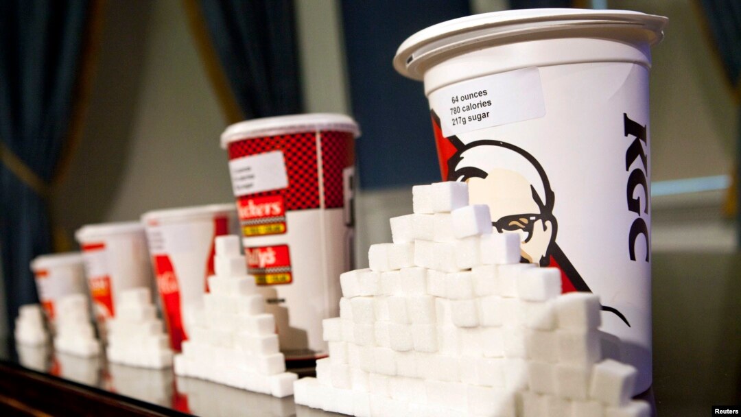 A 64-ounce drink is displayed alongside other soft drink cup sizes n New York, May 31, 2012. 