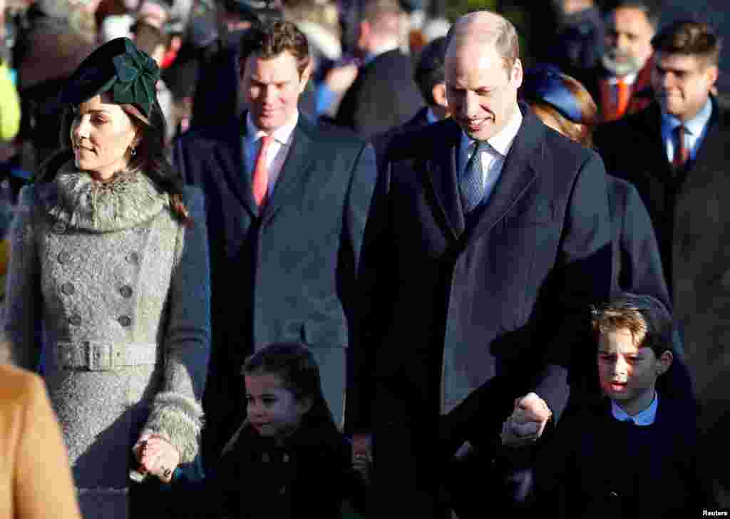 Britain’s Prince William, Catherine, Duchess of Cambridge, Prince George and Princess Charlotte arrive at St. Mary Magdalene's church for the Royal Family's Christmas Day service on the Sandringham estate in eastern England.