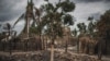 FILE - The remains of a burned home is seen in the recently attacked village of Aldeia da Paz, in the Cabo Delgado province, northern Mozambique, Aug. 24, 2019. Mozambique on April 6, 2023, legalized the involvement of local militias in the fight against Islamist militants.