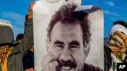 FILE - A photograph of jailed leader of the rebel Kurdistan Workers' Party, Abdullah Ocalan, is displayed in Diyarbakir, Turkey, Feb. 27, 2025.