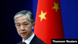Chinese Foreign Ministry spokesman Wang Wenbin speaks during a news conference in Beijing