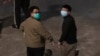 Hong Kong activists Joshua Wong, right, and Ivan Lam, left, are escorted by Correctional Services officers to prison, in Hong Kong, Dec. 2, 2020.