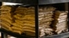 FILE - Bags of sample yellow soybeans are stored at Deerfield Farms Service on April 5, 2018, at the facility in Volant, Pa. Soybeans are among US agricultural products on China's retaliation list that could potentially harm Trump's large voter base in rural areas.