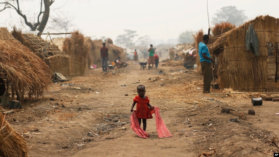 FILE - A child walks through a refugee camp in Kaga-Bandoro, Central African Republic, Feb. 16, 2016.